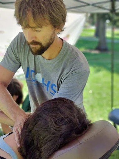Outdoor chair massage at a community event